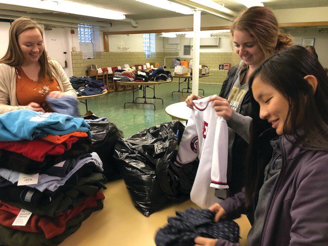 North Montgomery High School students sort clothes for the Volunteers for Mental Health in Montgomery County